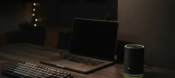 Home office desk with laptop and Wi-Fi router